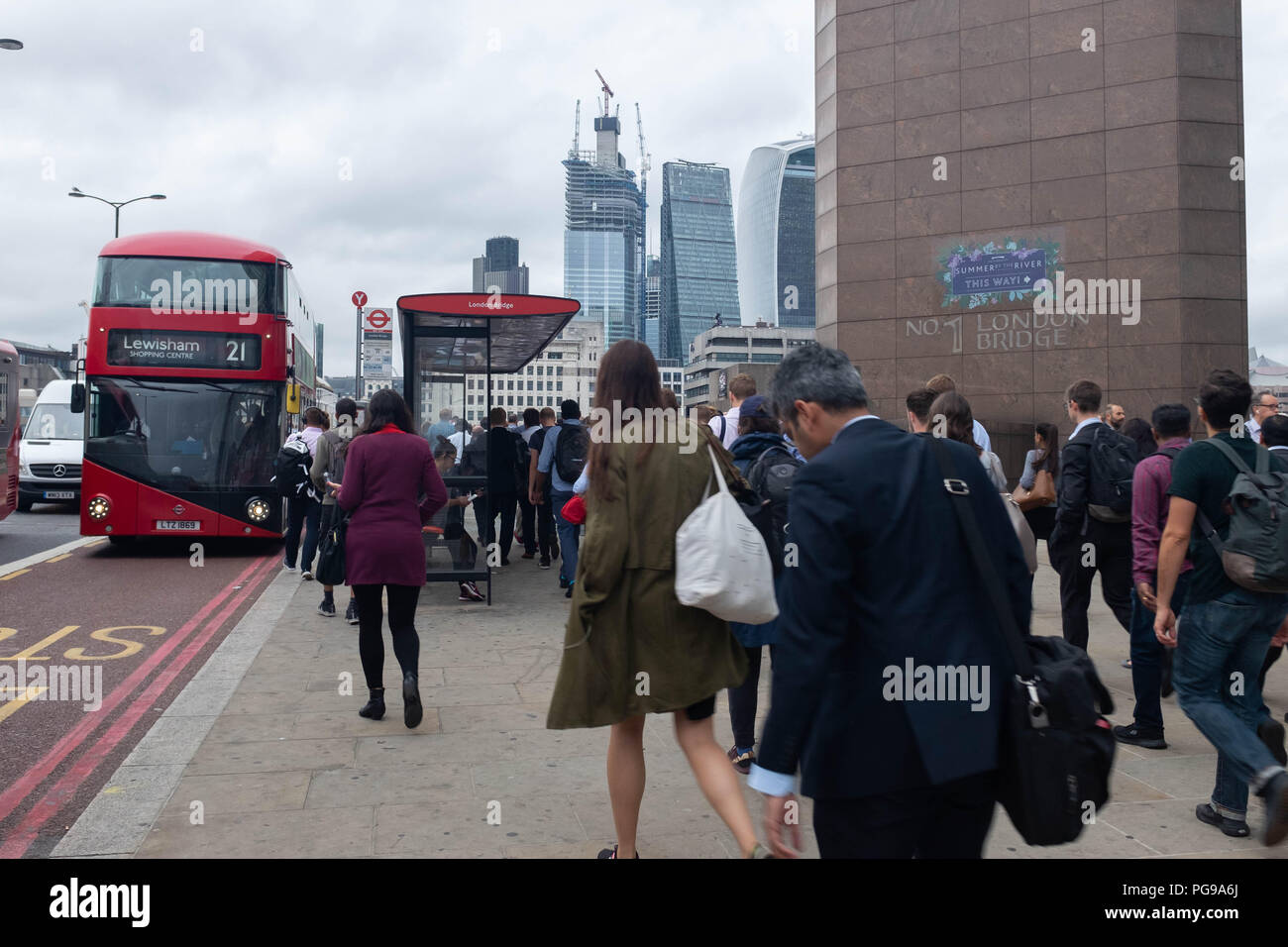 Morning commuters on London Bridge, London, England Stock Photo