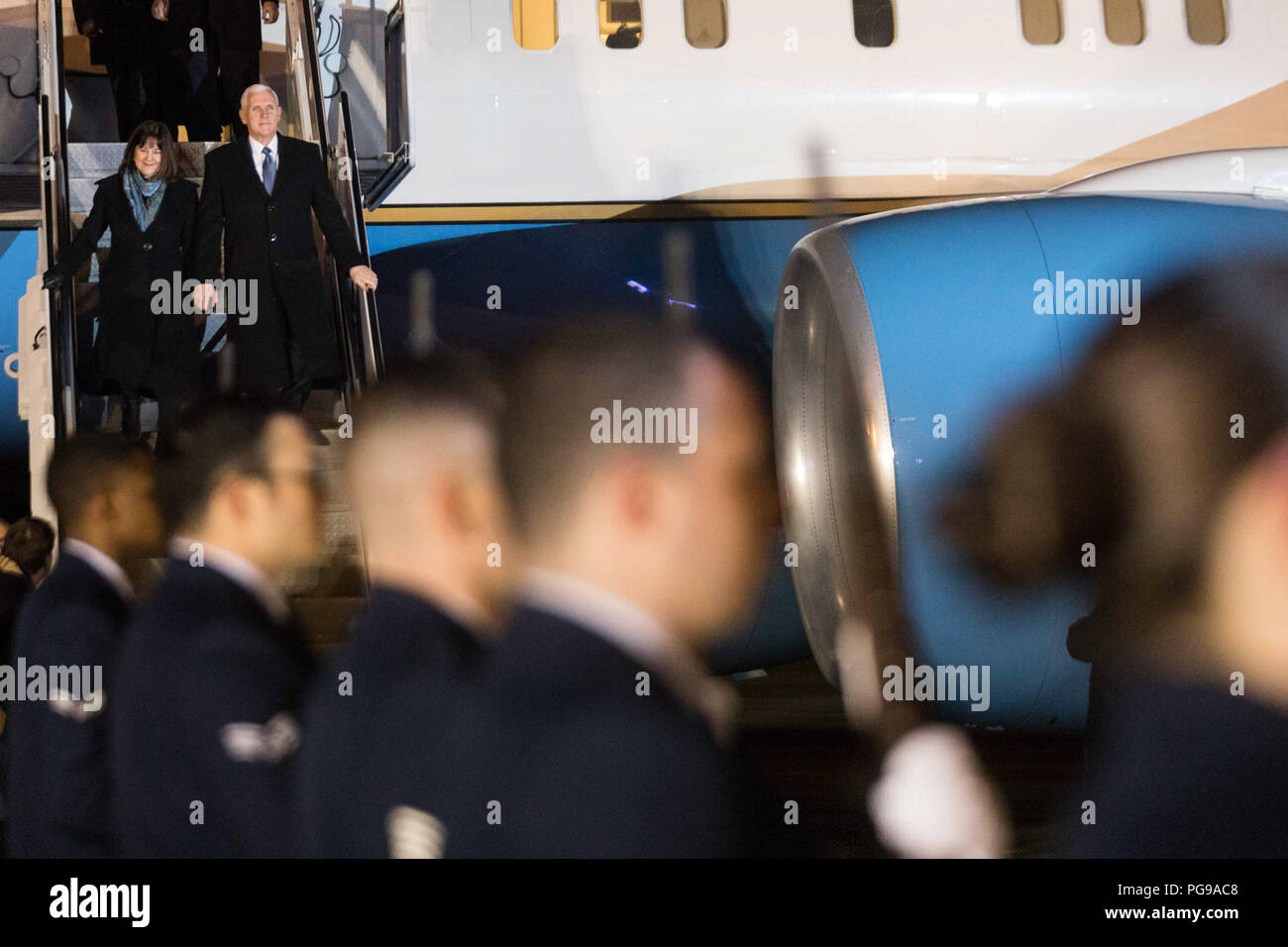 Vice President Mike Pence and Mrs. Karen Pence disembark Air Force Two at Yokota Air Base, Tuesday, February 6, 2018, and are greeted by U.S. Ambassador to Japan, Bill Hagerty and his wife Chrissy Hagerty, Masahisa Sato, Japanese State Minister for Foreign Affairs, Lt Gen. Jerry Martinez, Commander of the U.S. Force of Japan and his wife Kim Martinez and Col. Kenneth Moss, Commander of Yokota Air Base and his wife Molly Moss, in Tokyo, Japan. Vice President Pence's Trip to Asia Stock Photo