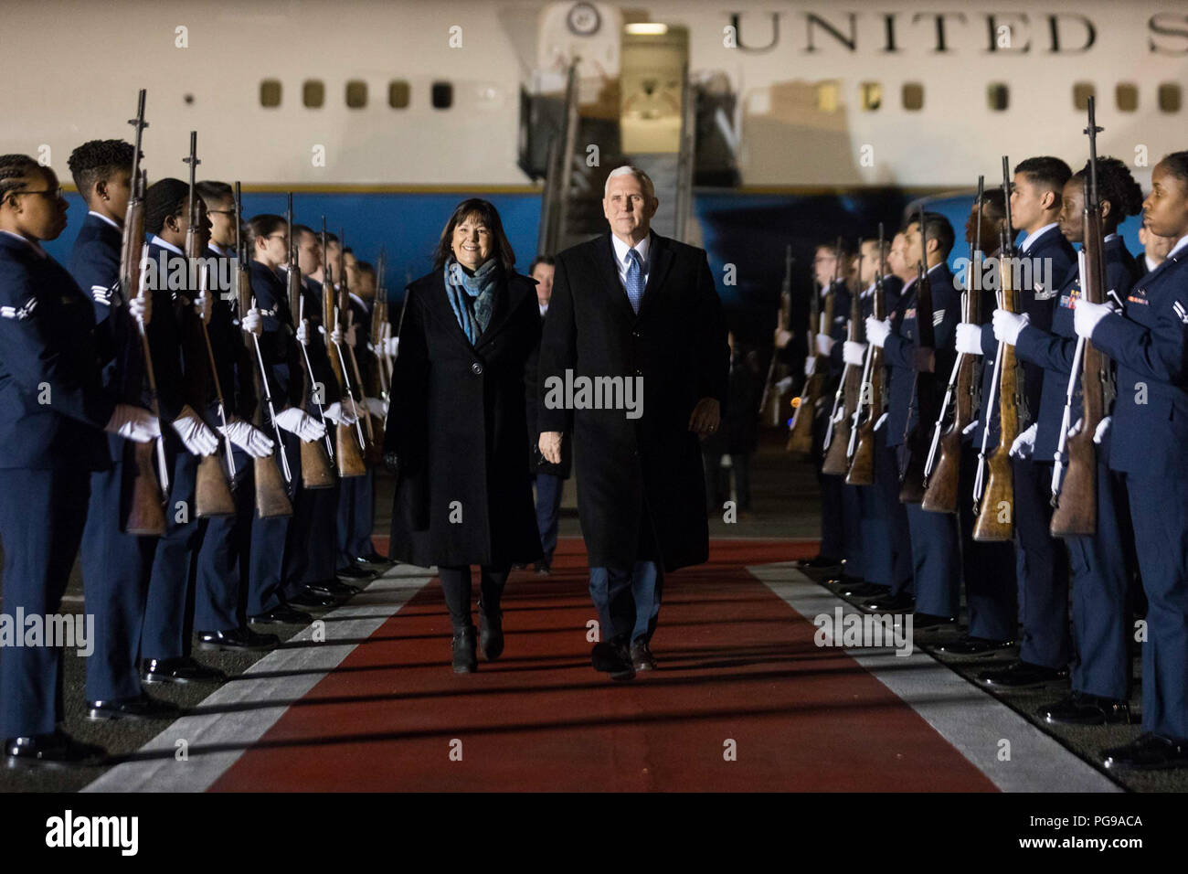 Vice President Mike Pence and Mrs. Karen Pence disembark Air Force Two at Yokota Air Base, Tuesday, February 6, 2018, and are greeted by U.S. Ambassador to Japan, Bill Hagerty and his wife Chrissy Hagerty, Masahisa Sato, Japanese State Minister for foreign affairs, Lt Gen. Jerry Martinez, Commander of the U.S. Force of Japan and his wife Kim Martinez and Col. Kenneth Moss, Commander of Yokota Air Base and his wife Molly Moss, in Tokyo, Japan. Vice President Pence's Trip to Asia Stock Photo