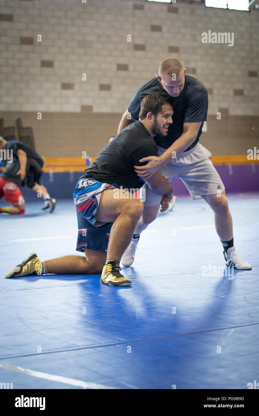 Nick Gwiazdowski, wrestler, USA Wrestling Men’s Freestyle World Team, left, practices a technique with Jake Varner, wrestler, USA Wrestling Men’s Freestyle World Team, at the 43 Fitness Center at Marine Corps Base Camp Pendleton, California, Aug. 20, 2018. The team was practicing in preparation for the 2018 World Wrestling Championships at Budapest this October. (U.S. Marine Corps photo by Lance Cpl. Betzabeth Y. Galvan) Stock Photo