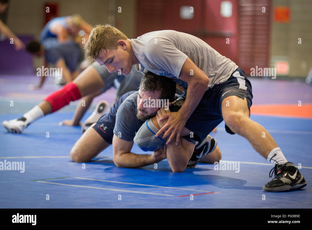 Micky Philippi, top, and Zayn Richards, wrestlers, USA Wrestling Men’s Freestyle World Team, train at the 43 Fitness Center at Marine Corps Base Camp Pendleton, California, Aug. 20, 2018. Today was the first day of a two-week training camp in which wrestlers learned different maneuvers and how to improvise when caught in troublesome positions. (U.S. Marine Corps photo by Lance Cpl. Betzabeth Y. Galvan Stock Photo