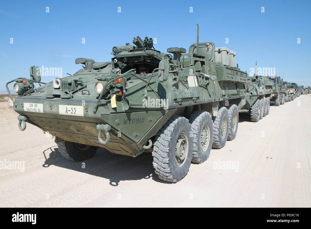 The 56th Stryker Brigade Combat Team, 28th Infantry Division, Pennsylvania Army National Guard convoys from the National Training Center, Fort Irwin, California to the railhead at Yermo, California, Aug. 20, where Soldiers prepared the vehicles to be loaded on to the railhead for transport back to Pennsylvania. (U.S. Army National Guard Photo by Cpl. Hannah Baker/released) Stock Photo