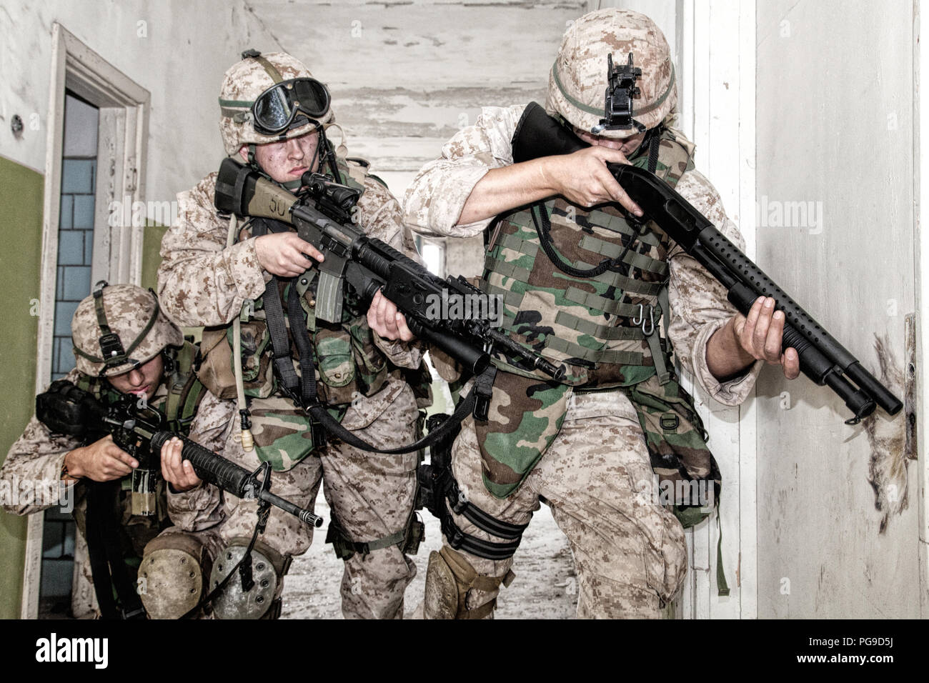 Marines clearing rooms with fight in city quarter Stock Photo