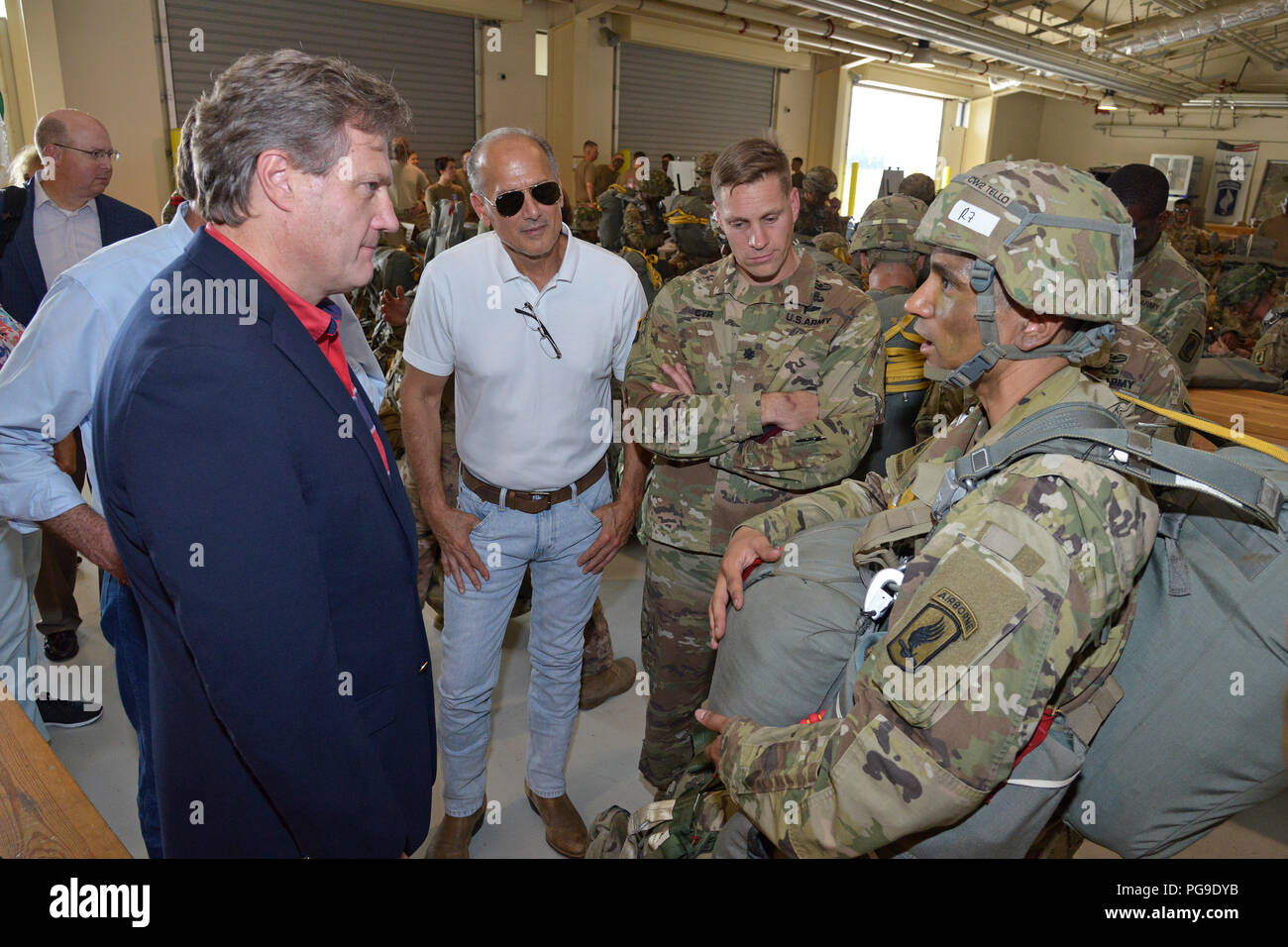 From Left, U.S. Rep. Michael Turner, U.S. Rep. Tom Marino and Army Lt. Col. Kurt Cyr listen to a brief from Chief Warrant Officer 2 Emmanuel Tello, assigned to 173rd Airborne Brigade in the Personnel Alert Holding Area (PAHA), during a Congressional Delegation visit to Aviano Air Base, Italy, Aug. 23, 2018. The 173rd Airborne Brigade is the U.S. Army Contingency Response Force in Europe, capable of projecting ready forces anywhere in the U.S. European, Africa or Central Commands' areas of responsibility. (U.S. Army photo by Paolo Bovo) Stock Photo