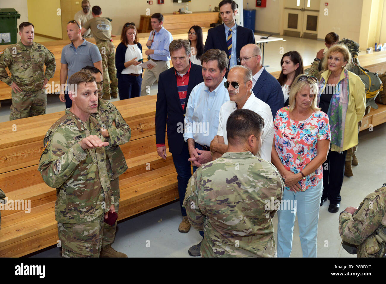 From left, U. S. Army Lt. Col. Kurt J. Cyr, deputy commander of 173rd Airborne Brigade, brief members of the House Armed Services Committee about airborne operations during a U.S. congressional staff delegation visit to the Personnel Alert Holding Area (PAHA) at Aviano Air Base, Italy, Aug. 23, 2018. The 173rd Airborne Brigade is the U.S. Army Contingency Response Force in Europe, capable of projecting ready forces anywhere in the U.S. European, Africa or Central Commands' areas of responsibility. (U.S. Army photo by Paolo Bovo) Stock Photo