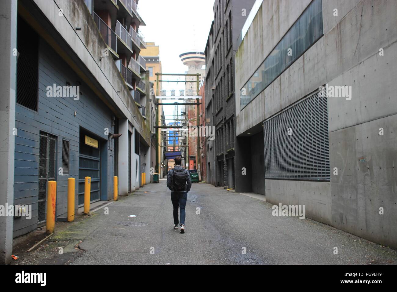 A Man Walking in the Backstreet of Gas Town, Vancouver, Canada Stock Photo