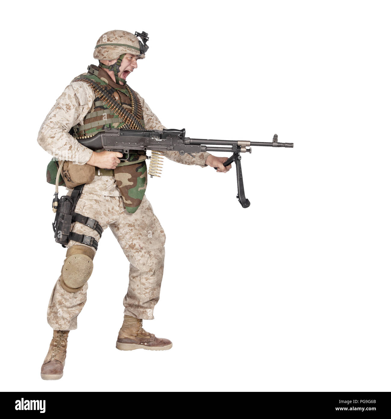 Screaming machine gunner soldier shooting from waist Stock Photo