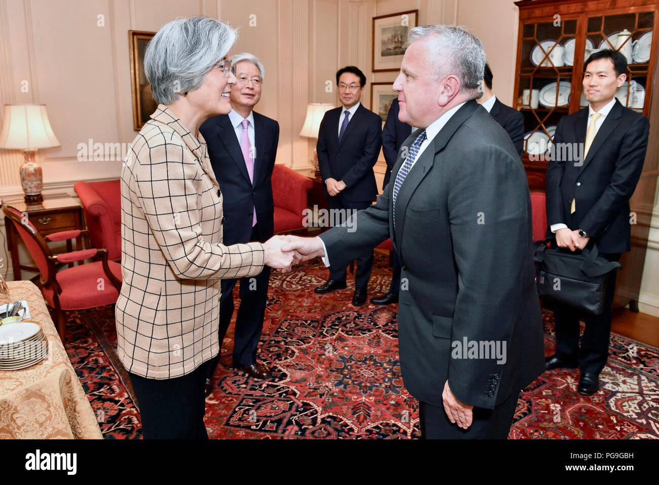 Deputy Secretary of State John Sullivan greets Republic of Korea Foreign Minister Kang Kyung-wha before they address reporters at the U.S. Department of State in Washington, D.C. on March 16, 2018. Stock Photo