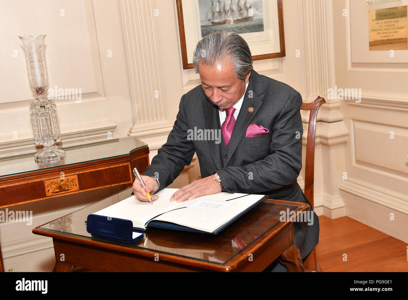 Malaysian Foreign Minister Anifah Aman signs the guest book at the U.S. Department of State in Washington, D.C. on March 26, 2018. Stock Photo