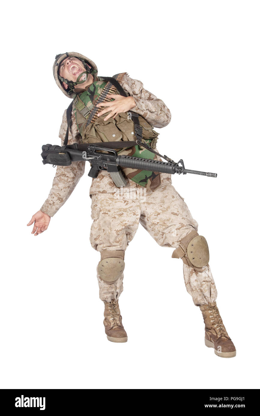 Wounded solder screaming and falling studio shoot Stock Photo