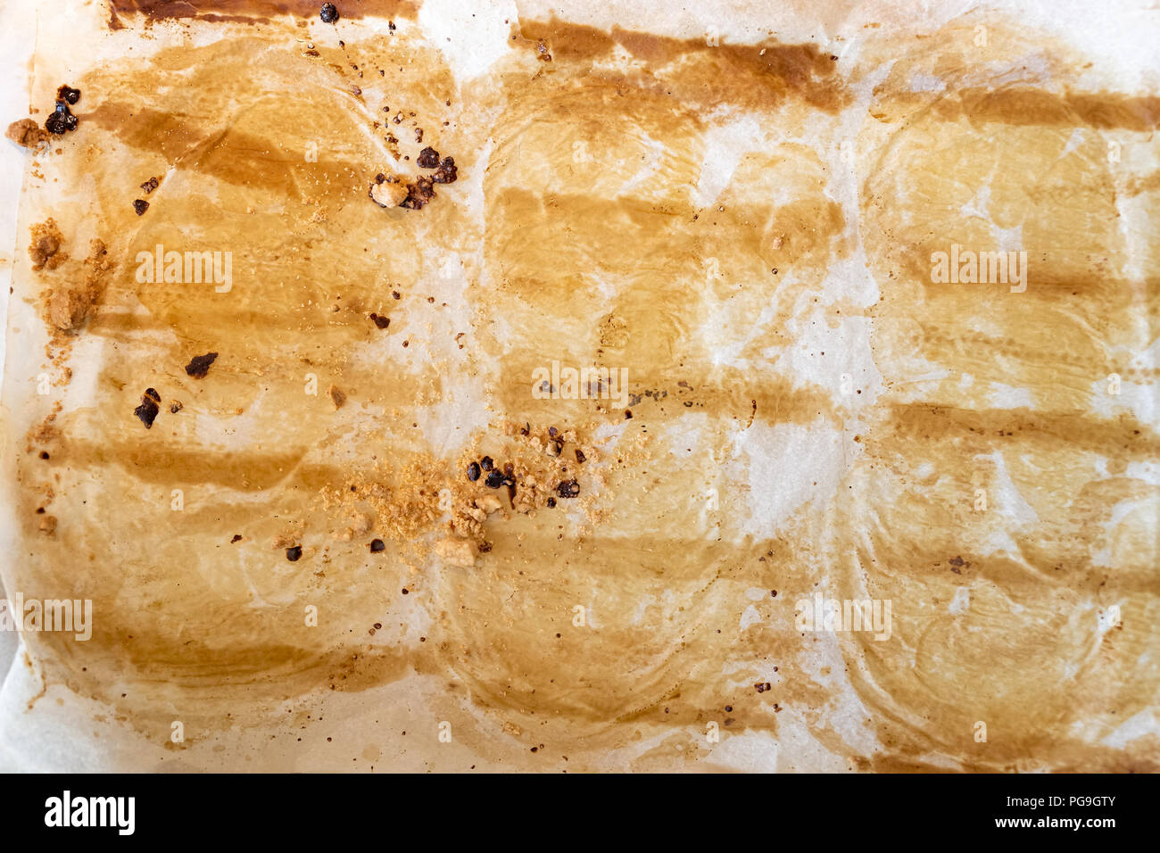 Background of used wax paper baking sheet with baking marks Stock Photo