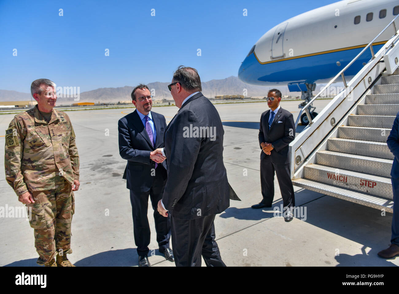 U.S. Secretary of State Michael R. Pompeo is greeted by U.S. Ambassador to Afghanistan John Bass and General John Nicholson upon arrival to Bagram Airfield on July 9, 2018. Stock Photo