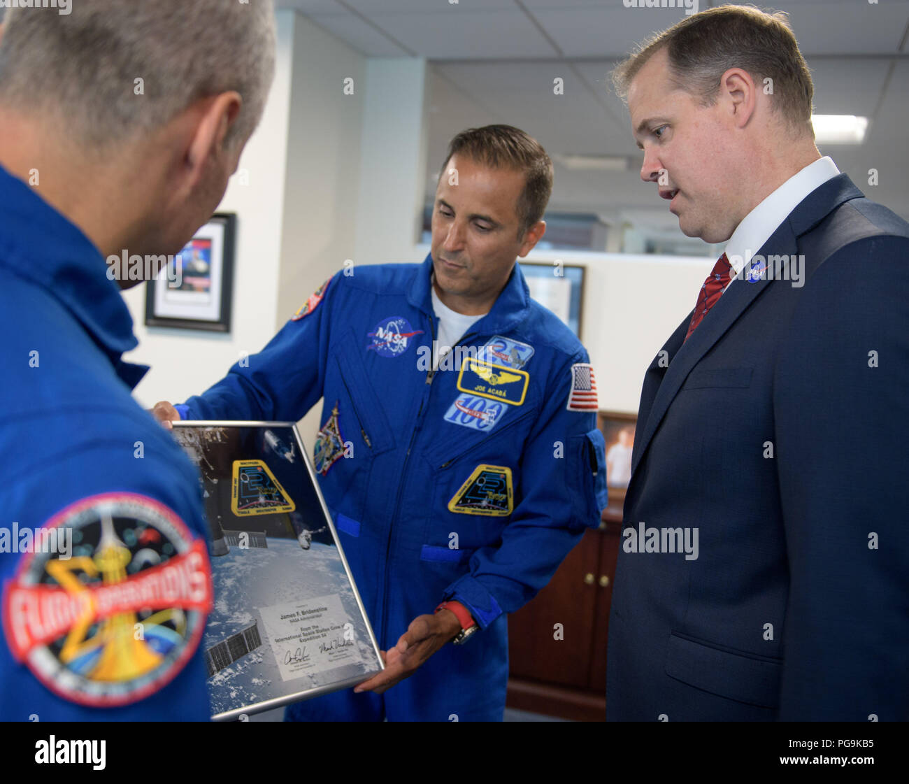 NASA Administrator Jim Bridenstine, right, meets with Expedition 54 NASA astronauts Mark Vande Hei, left, and Joe Acaba during their Expedition 54 post flight, Wednesday, June 13, 2018 at NASA Headquarters, Washington. Stock Photo