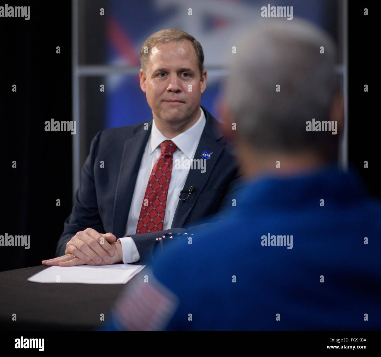 NASA Administrator Jim Bridenstine is seen as he meets with Expedition 54 NASA astronauts Joe Acaba and Mark Vande Hei during their Expedition 54 post flight, Wednesday, June 13, 2018 at NASA Headquarters, Washington. Stock Photo