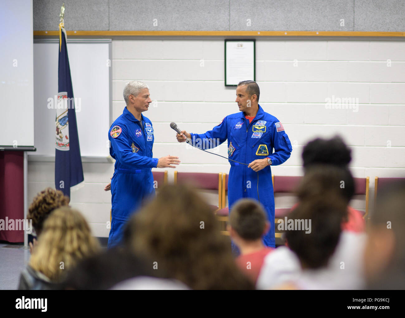 NASA astronauts Mark Vande Hei, left, and Joe Acaba answer questions during a presentation to students at Walt Whitman Middle School, Thursday, June 14, 2018 in Alexandria, Va. Acaba and astronaut Mark Vande Hei answered questions from the audience and spoke about their experiences aboard the International Space Station for 168 days as part of Expedition 53 and 54. Stock Photo