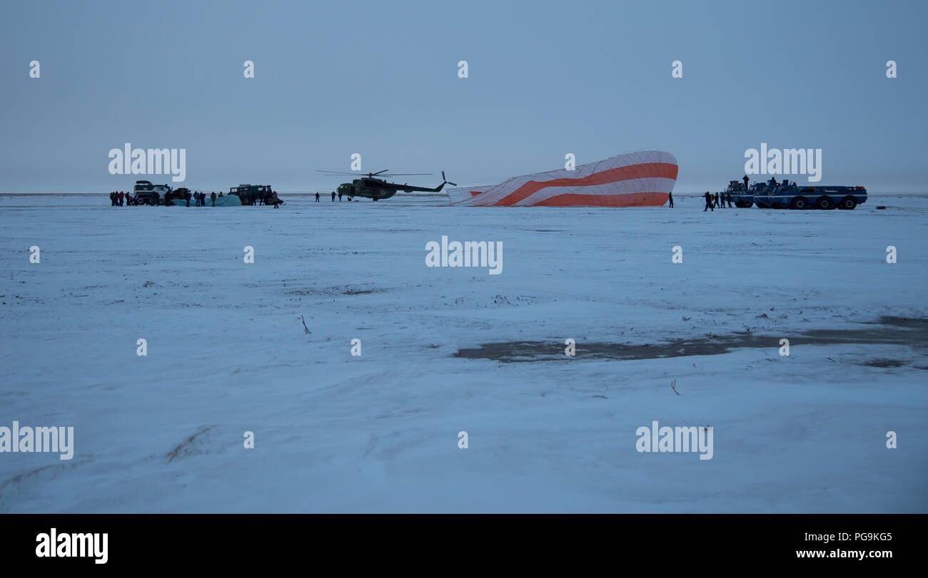 Russian Search and Rescue teams arrive at the Soyuz MS-06 spacecraft shortly after it landed with Expedition 54 crew members Joe Acaba and Mark Vande Hei of NASA and cosmonaut Alexander Misurkin near the town of Zhezkazgan, Kazakhstan on Wednesday, Feb. 28, 2018 (February 27 Eastern time.)  Acaba, Vande Hei, and Misurkin are returning after 168 days in space where they served as members of the Expedition 53 and 54 crews onboard the International Space Station. Stock Photo