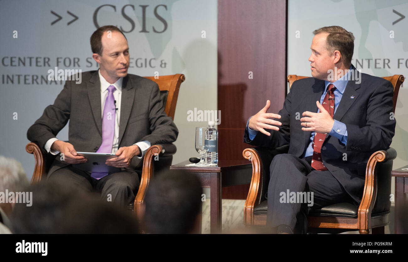 Todd Harrison, director of defense budget analysis and the aerospace security project, and senior fellow in the international security program at the Center for Strategic and International Studies, left, leads a discussion with NASA Administrator Jim Bridenstine, right, during an event celebrating NASA's 60th anniversary at the Center for Strategic and International Studies on Monday, July 23, 2018 in Washington. Bridenstine, and former NASA Administrators Sean O'Keefe and Charles Bolden answered questions about the past and future of the agency. ( Stock Photo