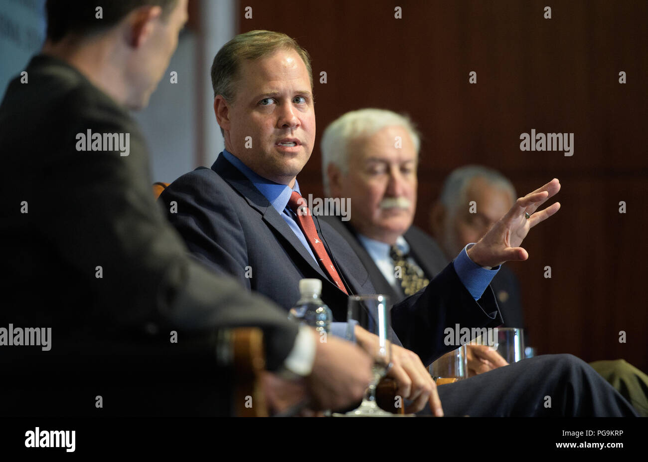 NASA Administrator Jim Bridenstine answers a question during a discussion with Todd Harrison, director of defense budget analysis and the aerospace security project, and senior fellow in the international security program at the Center for Strategic and International Studies and former NASA Administrators Sean O'Keefe and Charles Bolden during an event celebrating NASA's 60th anniversary at the Center for Strategic and International Studies on Monday, July 23, 2018 in Washington. Bridenstine, O'Keefe, and Bolden answered questions about the past and future of the agency. ( Stock Photo