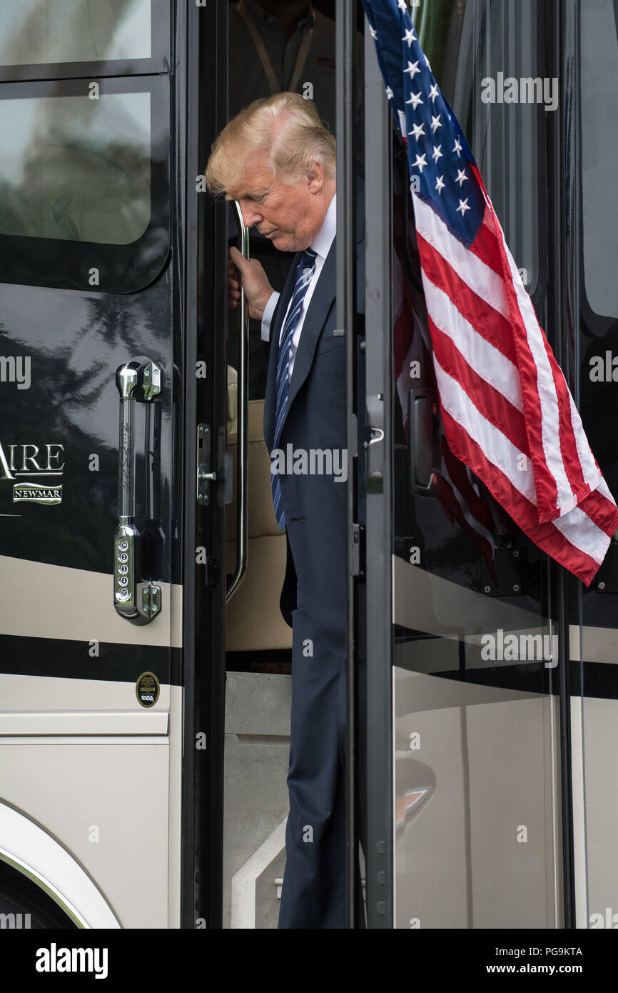 President Donald Trump tours a bus during the Made in America Product Showcase at the White House, Monday, July 23, 2018 in Washington.  The Orion crew module that launched on Dec. 5, 2014 on the Exploration Flight Test-1 was also on display during the event. Lockheed Martin, NASA’s prime contractor for Orion, began manufacturing the Orion crew module in 2011 and delivered it in July 2012 to NASA's Kennedy Space Center where final assembly, integration and testing was completed. More than 1,000 companies across the country manufactured or contributed elements to the spacecraft. Stock Photo