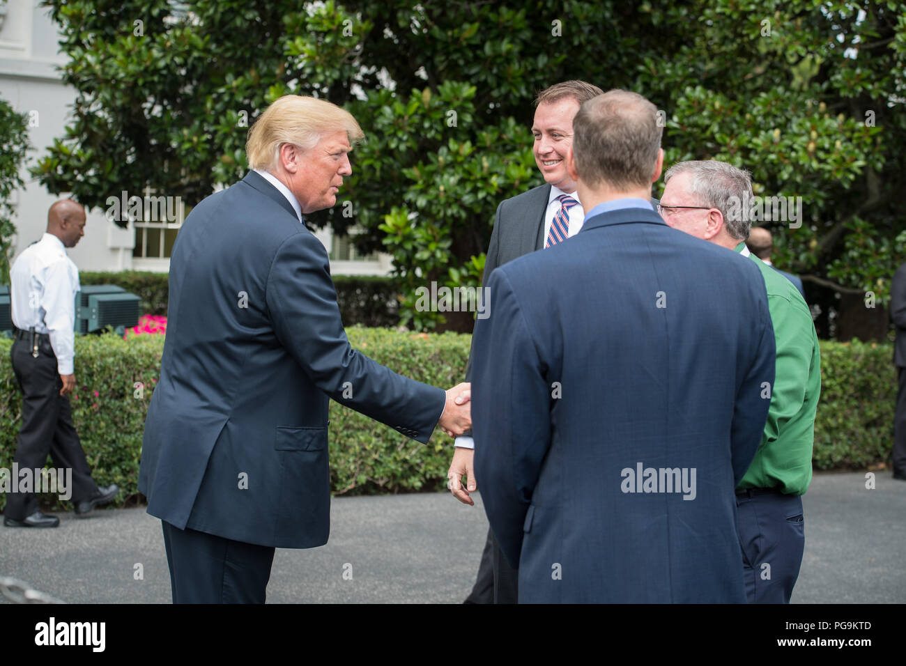 President Donald Trump meets NASA Administrator Jim Bridenstine, front, NASA Chief Financial Officer Jeff DeWitt, second from left, and Orion Program Manager, W. Michael Hawes, right, during a Made in America Product Showcase at the White House, Monday, July 23, 2018 in Washington. The Orion crew module that launched on Dec. 5, 2014 on the Exploration Flight Test-1 was also on display during the event. Lockheed Martin, NASA’s prime contractor for Orion, began manufacturing the Orion crew module in 2011 and delivered it in July 2012 to NASA's Kennedy Space Center where final assembly, integrati Stock Photo