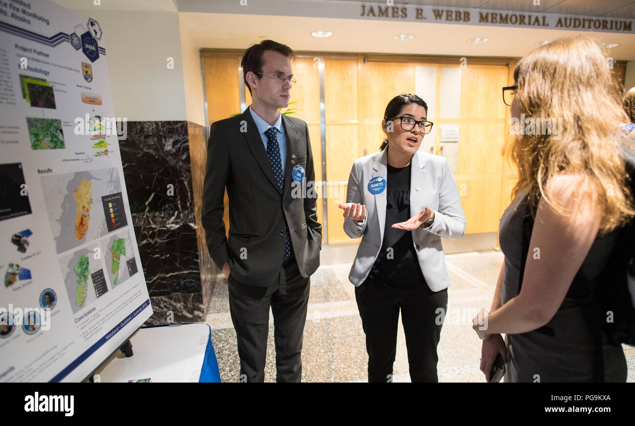 Students and young professionals discuss their projects at the Earth Science Applications Showcase Wednesday, August 1, 2018 at NASA Headquarters in Washington. Every summer, participants in NASA’s Applied Sciences’ DEVELOP National Program come to NASA Headquarters and present their research projects. DEVELOP is a training and development program where students work on Earth science research projects, mentored by science advisers from NASA and partner agencies, and extend research results to local communities. Stock Photo