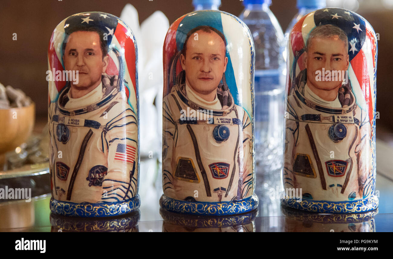 Matryoshka Dolls depicting NASA astronaut Joe Acaba, left, Russian cosmonaut Alexander Misurkin, center, and NASA astronaut Mark Vande Hei are seen during a welcome ceremony Wednesday, Feb. 28, 2018 in the Zhezkazgan Airport, Kazakhstan.  Acaba, Vande Hei, and Misurkin are returning after 168 days in space where they served as members of the Expedition 53 and 54 crews onboard the International Space Station. Stock Photo