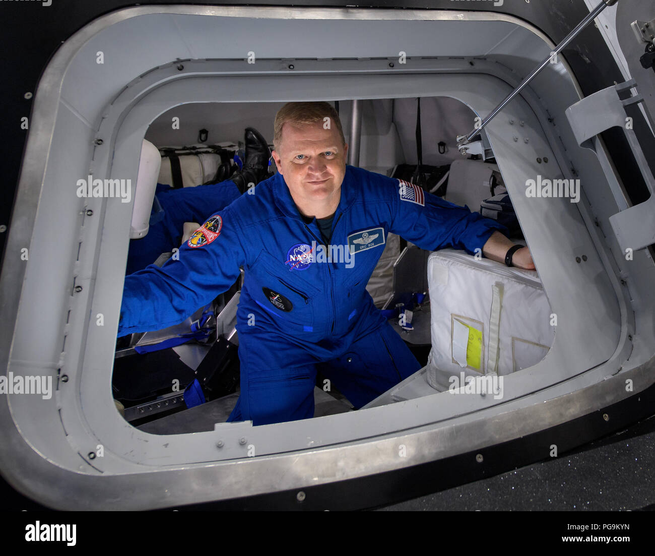 NASA astronaut Eric Boe poses for a photograph as he exits the Boeing Mockup Trainer at NASA’s Johnson Space Center in Houston, Texas on Aug. 2, 2018 ahead of the commercial crew flight assignments announcement Aug. 3. Boe, along with NASA astronaut Nicole Aunapu Mann and Boeing astronaut Chris Ferguson were assigned to launch aboard Boeing’s CST-100 Starliner on the company’s Crew Flight Test targeted for mid-2019 in partnership with NASA’s Commercial Crew Program. Stock Photo