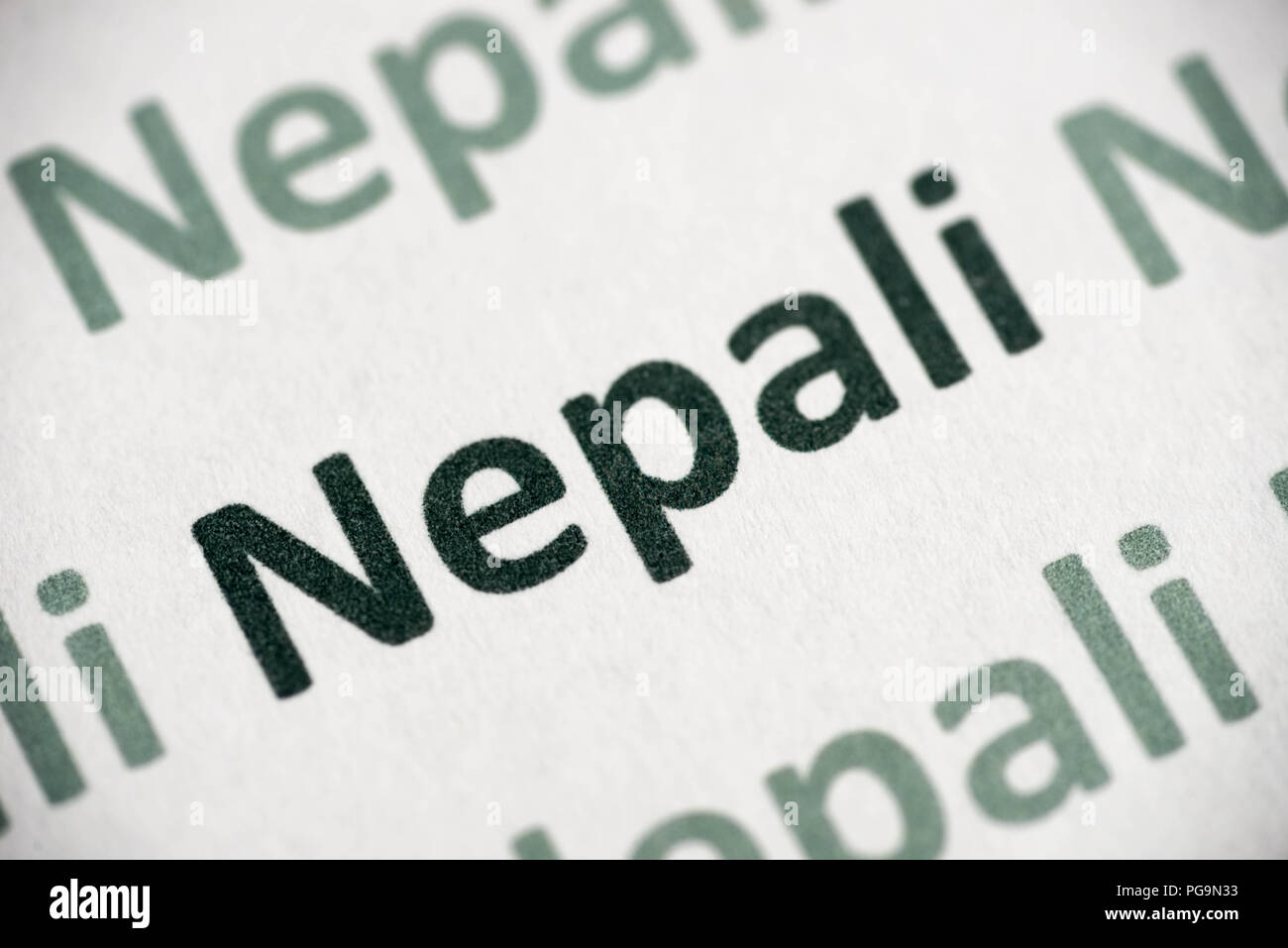 word Nepali language printed on white paper macro Stock Photo Alamy