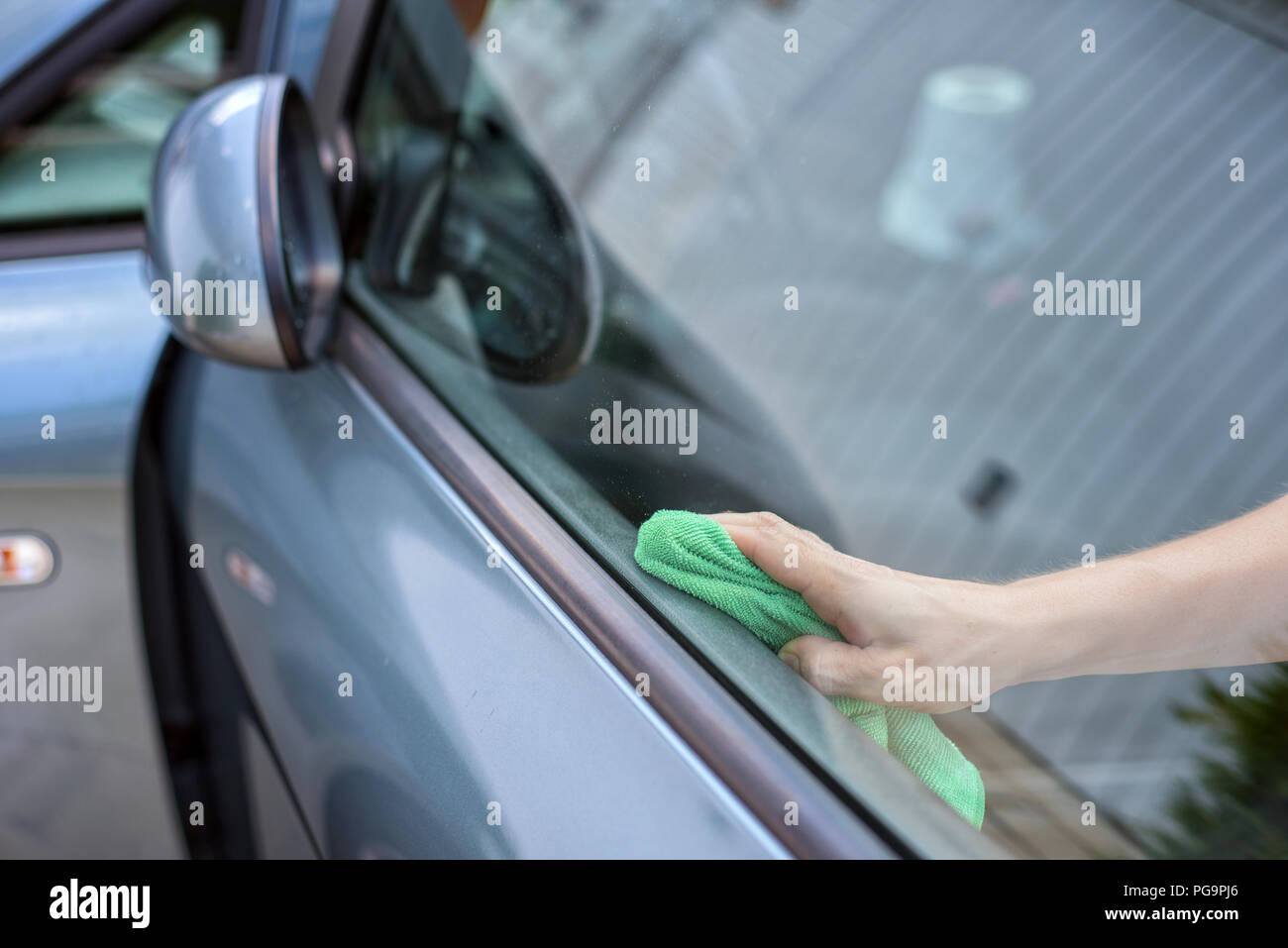 Young Woman Cleaning Car Interior With Microfiber Cloth Car