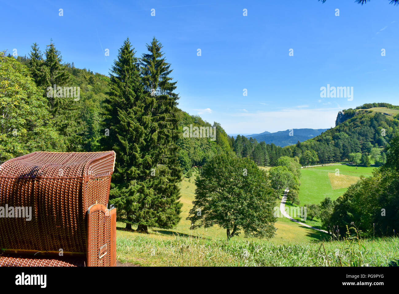 Typical Nord or Baltic sea beach chair baskets in forrest. Stock Photo