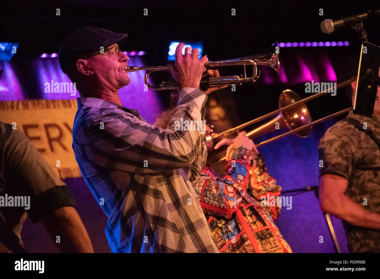 Brass musicians Karl Liberatore (trumpet) and Freedman Steorts (trombone) join Smalltown Poets for a couple songs during a concert at City Winery ATL. Stock Photo