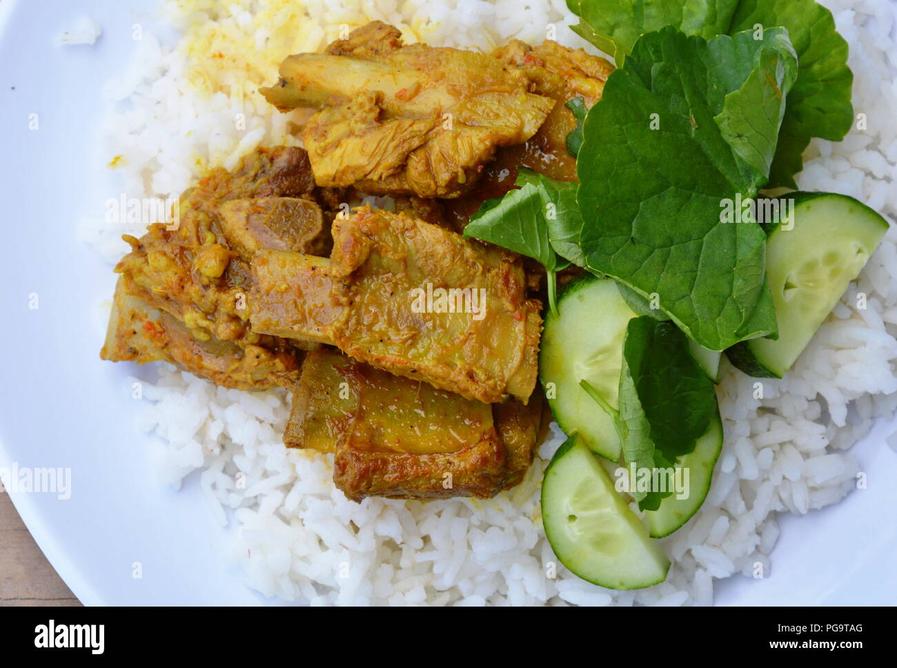 curry pork bone on rice Stock Photo Alamy