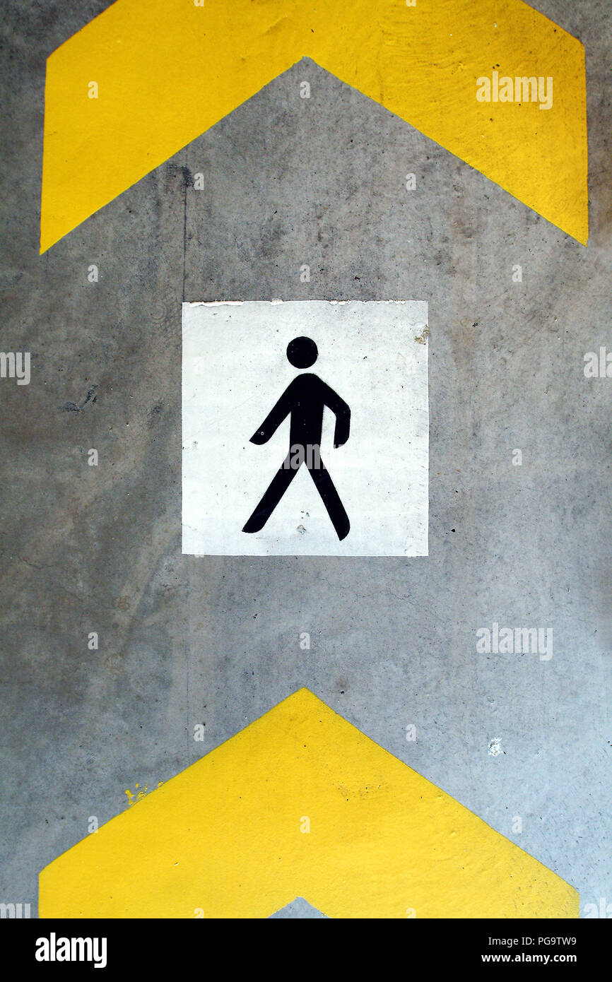 A pedestrian icon on the floor. Stock Photo