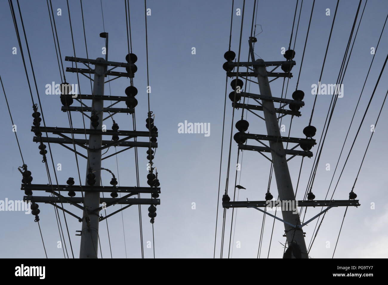 Electrical power lines hang from transmission pylons in Dhaka Stock