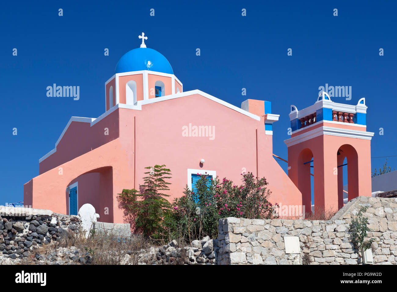 A little pink chapel on the northern side of Oia with deep blue sky. Santorini, Greece. Stock Photo
