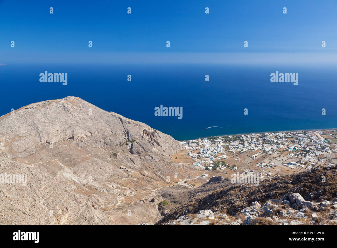 View from halfway up to the Profitis Ilias down to Perissa, Santorini. Stock Photo