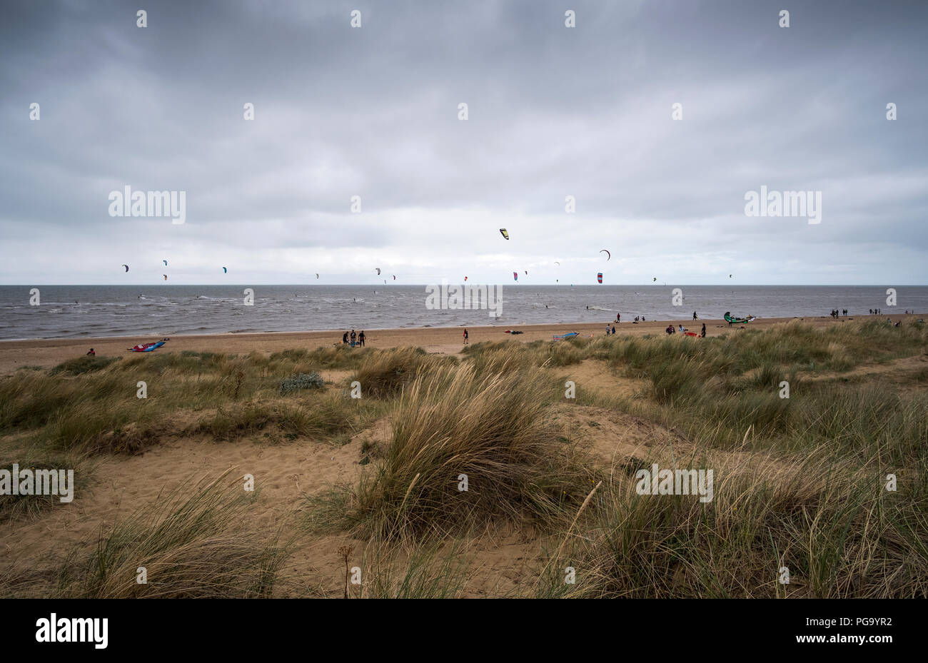 Old Hunstanton beach with kite surfers Stock Photo