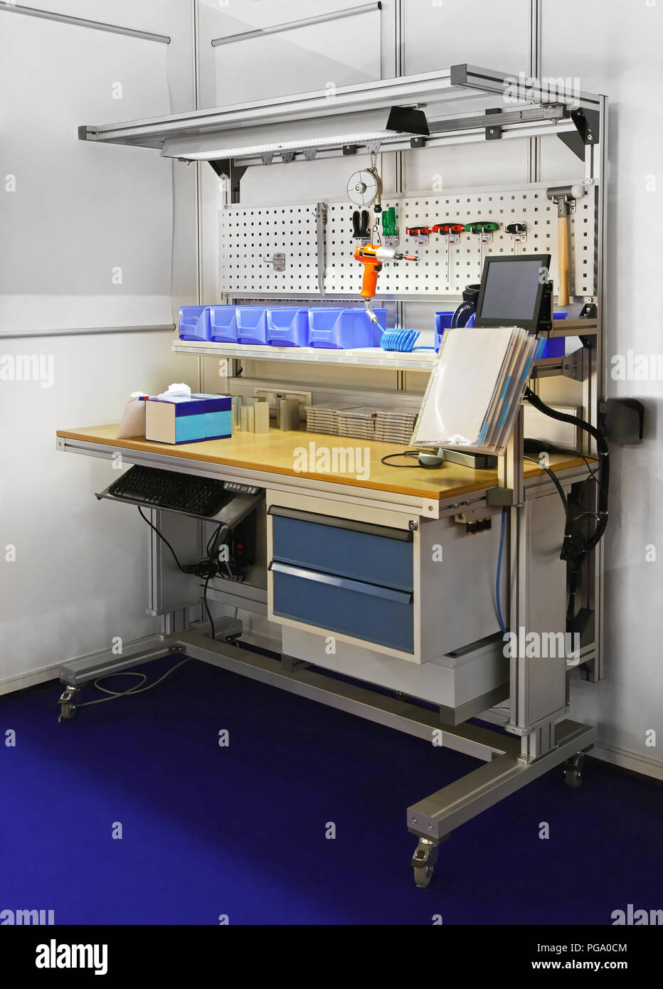 Technician workbench desk with shelves amd tools Stock Photo Alamy