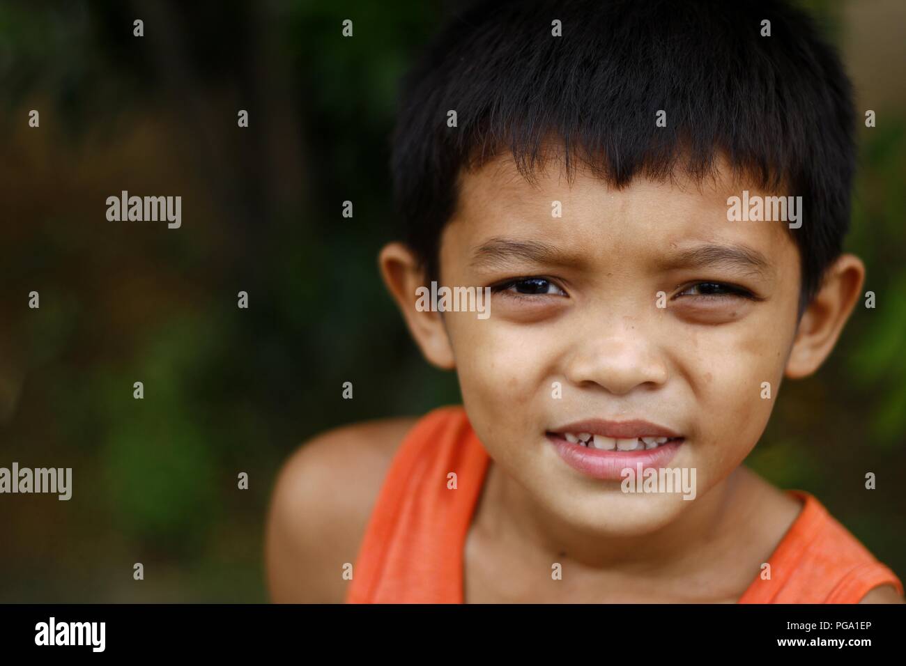 ANTIPOLO CITY, PHILIPPINES - AUGUST 18, 2018: A young Asian boy poses ...