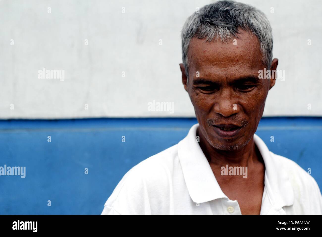 Antipolo City, Philippines - August 18, 2018: An adult Asian man poses and smiles for the camera. Stock Photo