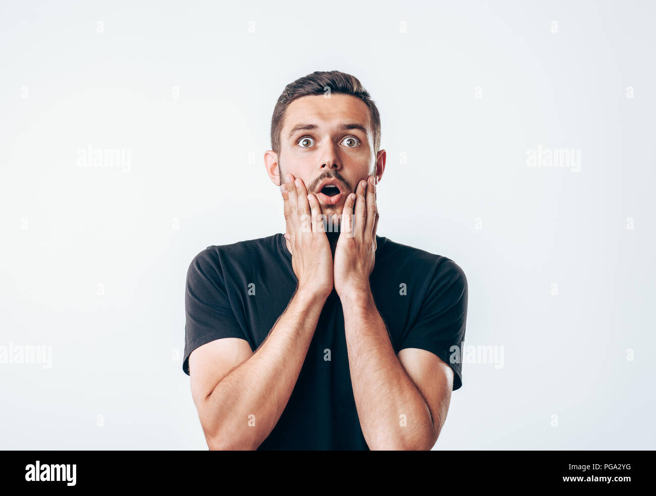 Portrait of young surprised man. People emotion facial expression Stock Photo