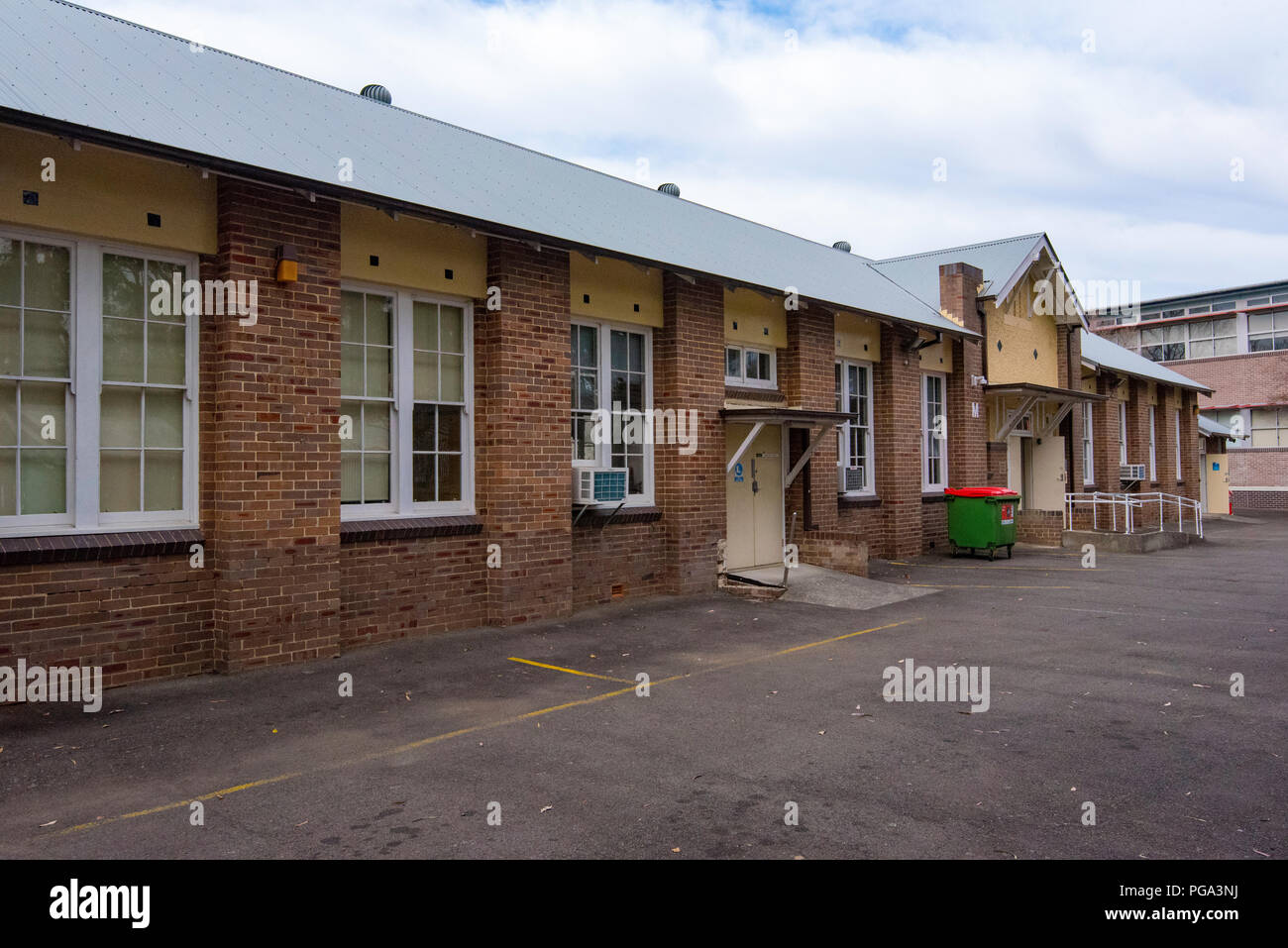 Building M an inter-war brick building that forms part of the Northern Sydney Institute or TAFE. The building has a galvanized steel roof Stock Photo