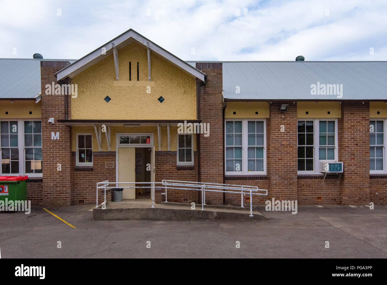 Building M an inter-war brick building that forms part of the Northern Sydney Institute or TAFE. The building has a galvanized steel roof Stock Photo