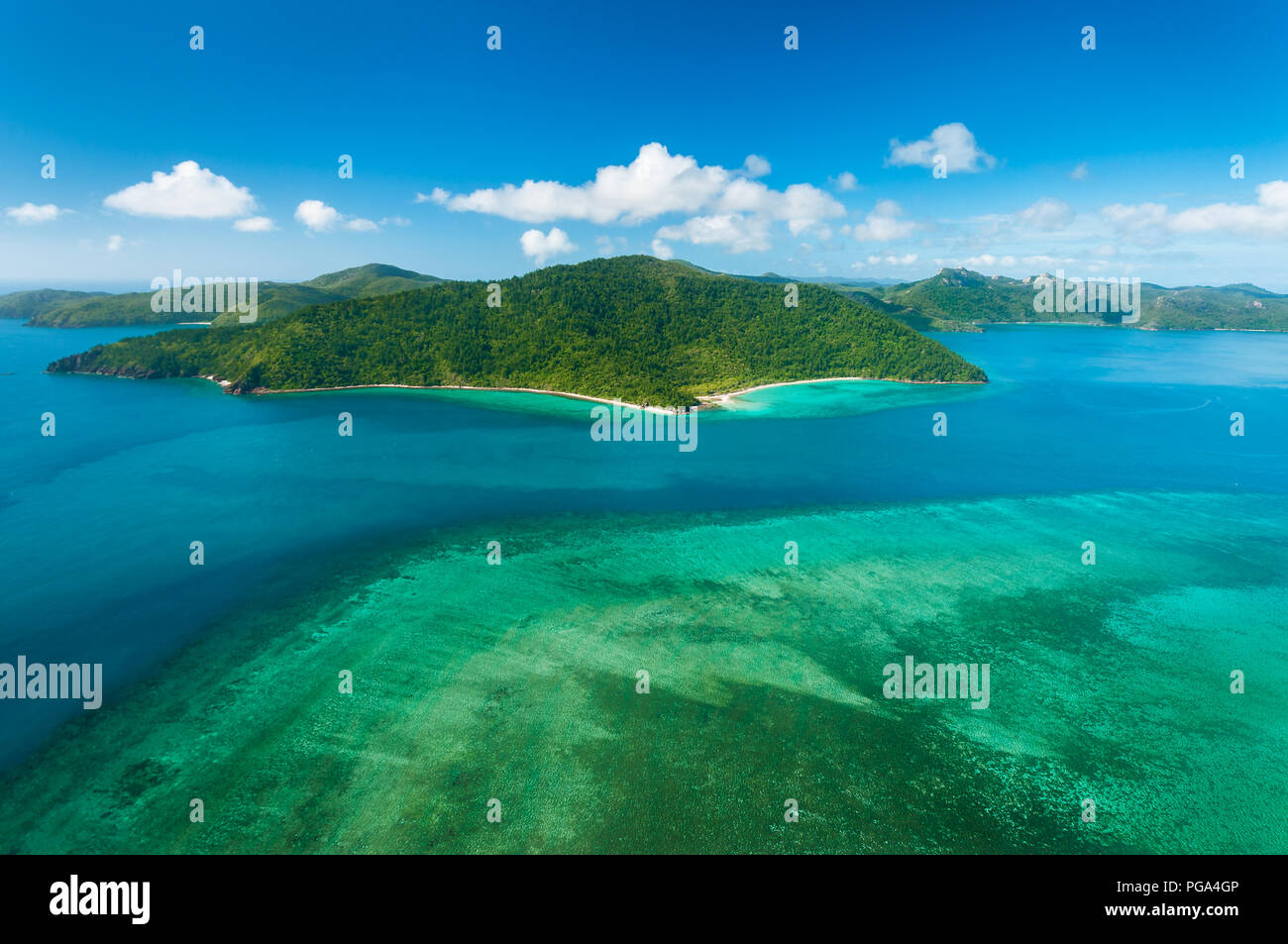 Hayman Island Reef with a view on Hook Island in the famous Whitsundays. Stock Photo