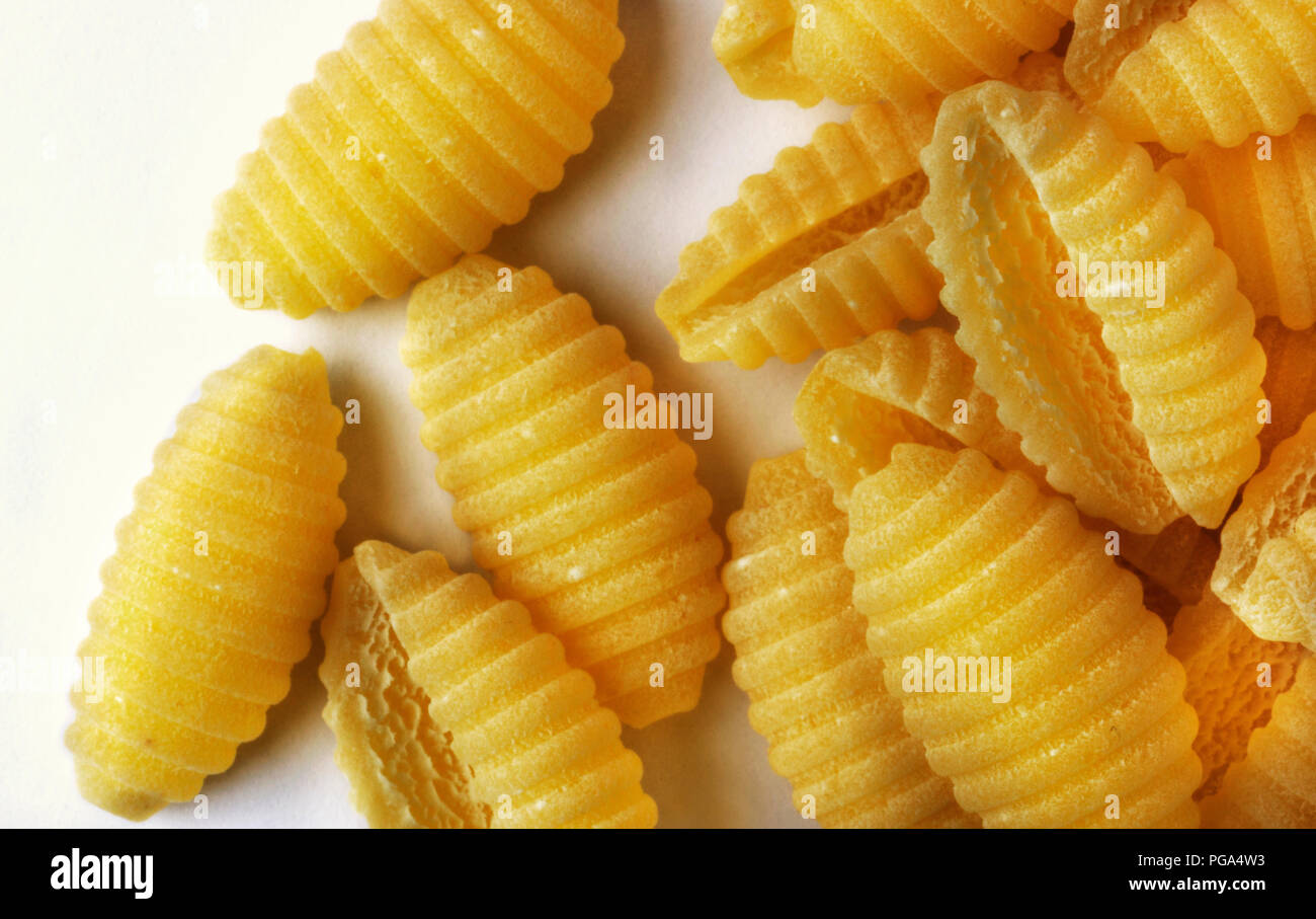 pasta dumplungs of durum wheat semolina also called malloreddus or gnocchetti sardi , Italian pasta , studio shot , white background Stock Photo