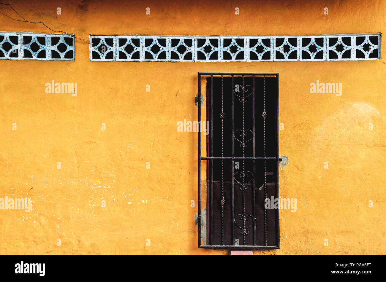 Front Of A Old Antique Traditional House With Vibrant Yellow Facade