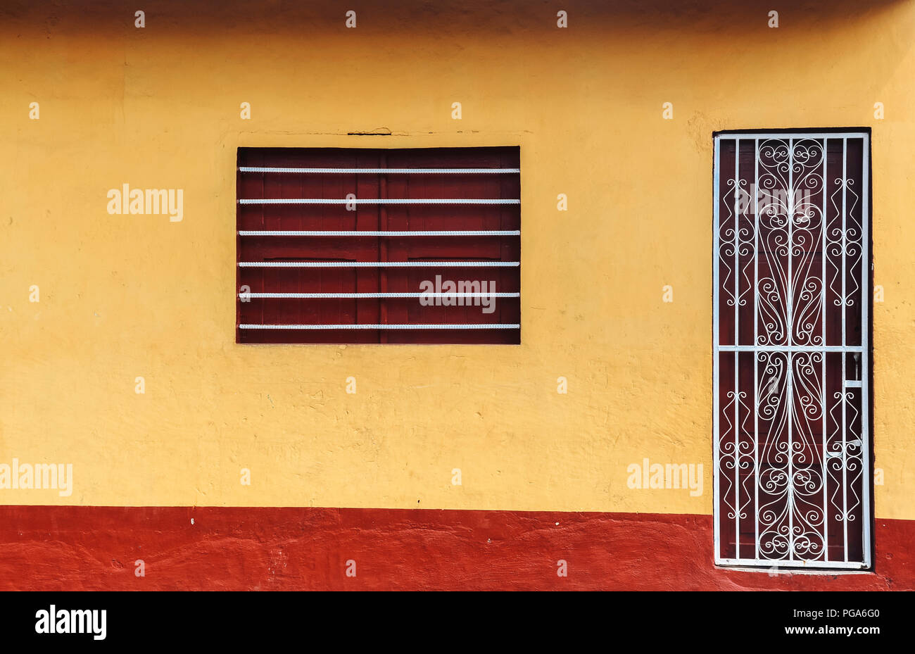 Front Of A Old Antique Traditional House With Vibrant Yellow Facade