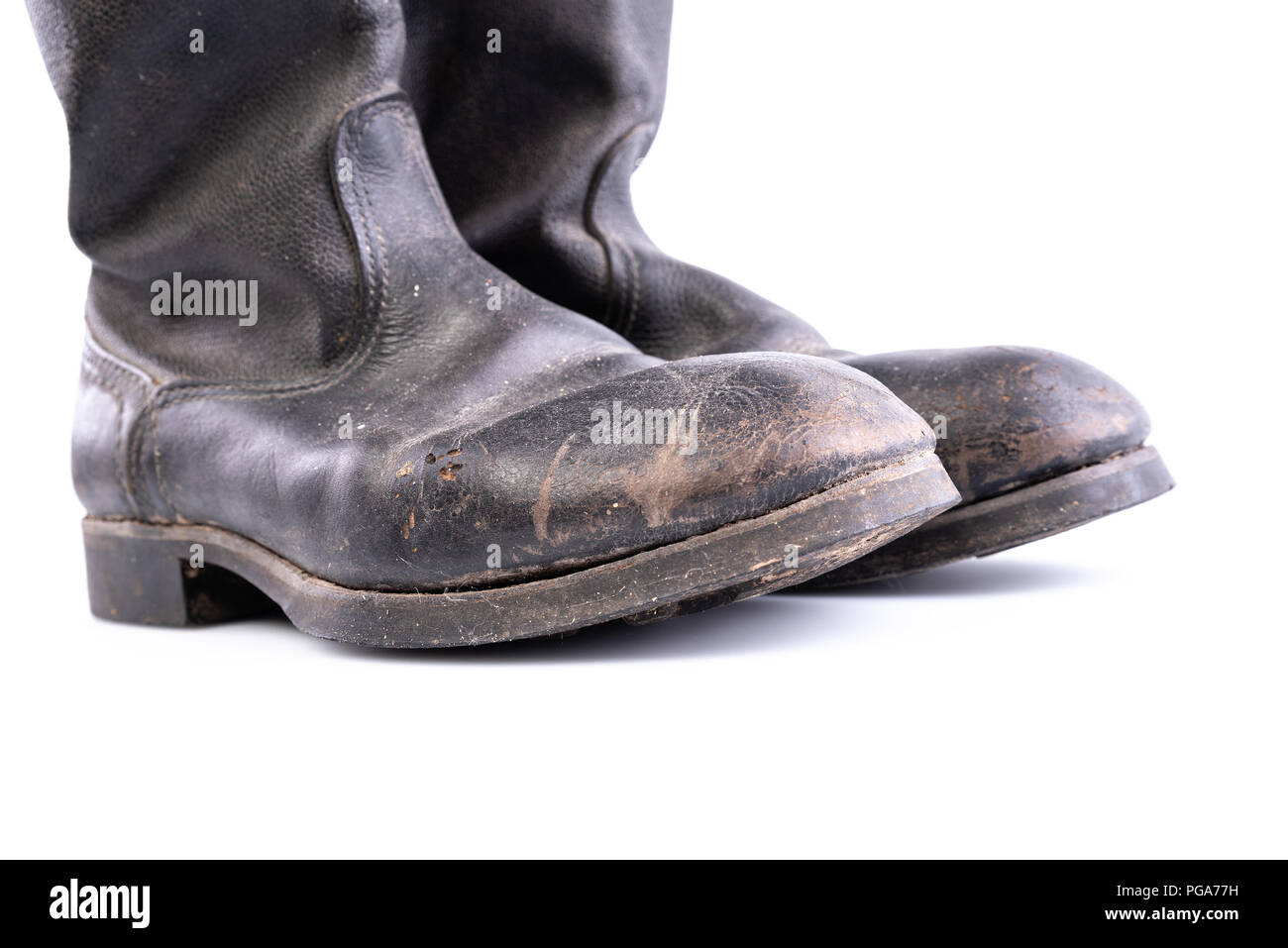 Retro boots - Kirza boots on white background, used in Soviet Union for soldiers in the army and for work, made of artificial leather Stock Photo