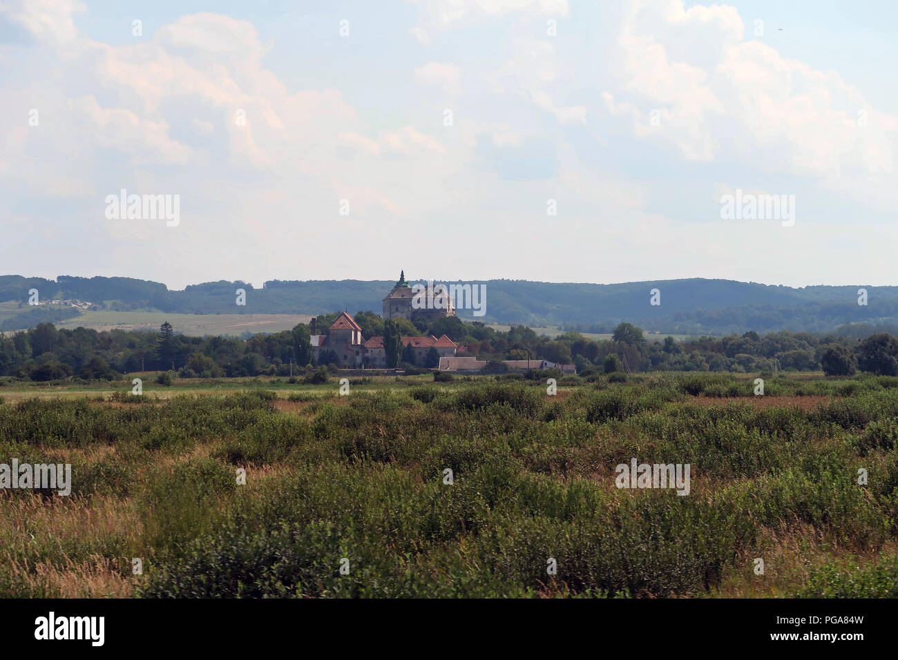 Distant view of Pidhirtsi Castle a residential castle-fortress built in 1640 located in the village of Pidhirtsi in Lviv Oblast (province) western Ukraine, located 80 kilometers east of Lviv.  The castle was then part of the Kingdom of Poland and it is regarded as the most valuable of palace-garden complexes in the eastern borderlands (Kresy Wschodnie) of the former Polish-Lithuanian Commonwealth. Stock Photo