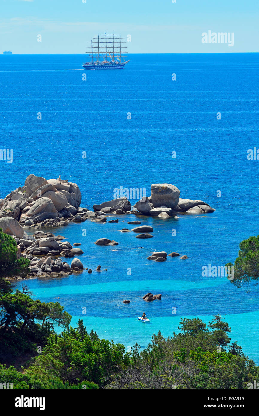 Palombaggia beach with turquoise blue sea and sailing ship, Porto Vecchio, Corse-du-Sud department, Corsica, France Stock Photo